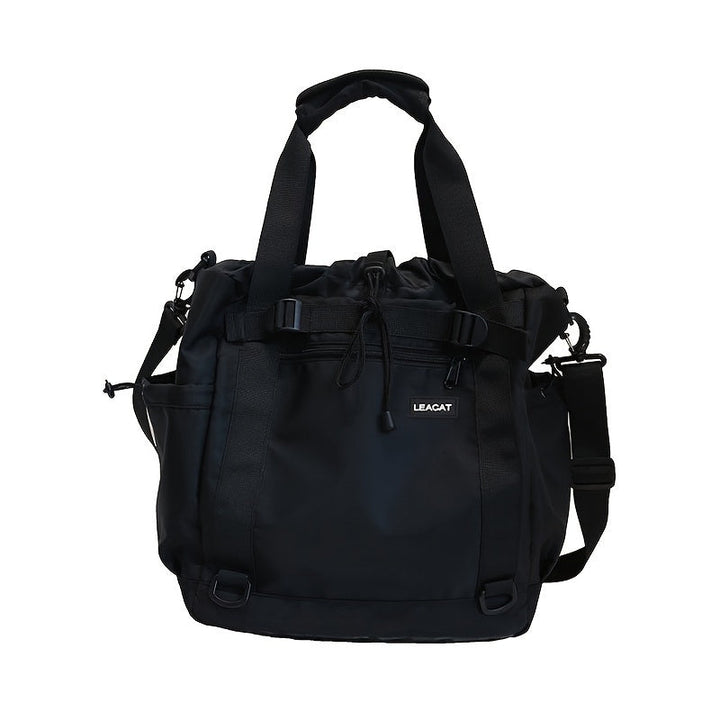 Borsa a tracolla nera LEACAT, design elegante e funzionale, con manici e cinghia regolabile, ideale per viaggi e uso quotidiano.