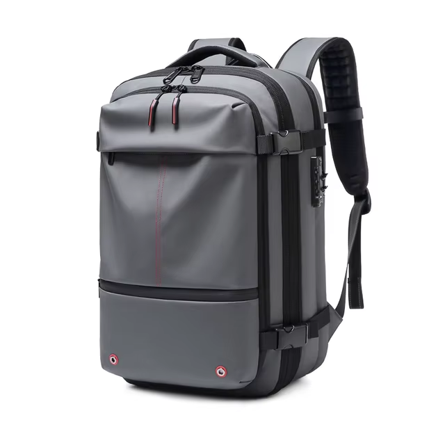 Zaino da viaggio grigio impermeabile, design moderno, con tasche multiple e spallacci imbottiti, ideale per escursioni e uso quotidiano.