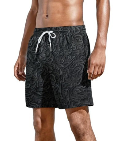 Pantaloncini da bagno uomo neri con motivo floreale, elastico in vita e laccio bianco. Ideali per nuoto e spiaggia. Tessuto leggero e comodo.