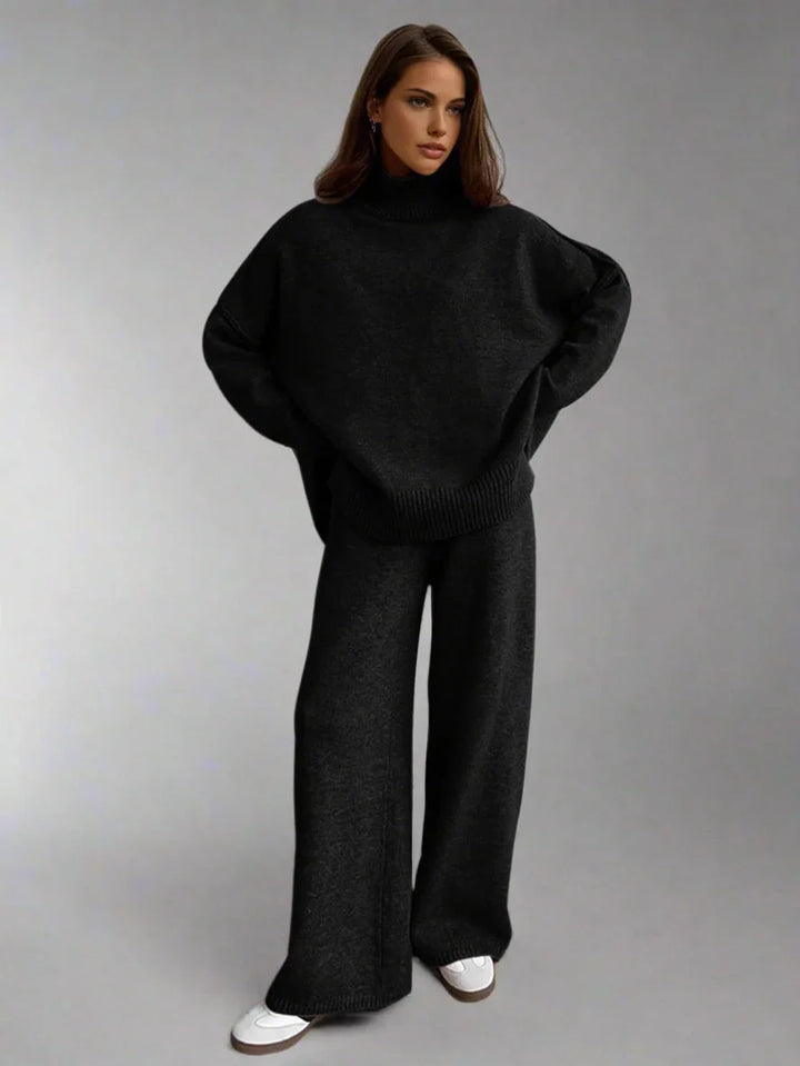 Ensemble femme rouge en maille douce, col roulé et coupe décontractée pour un confort optimal.