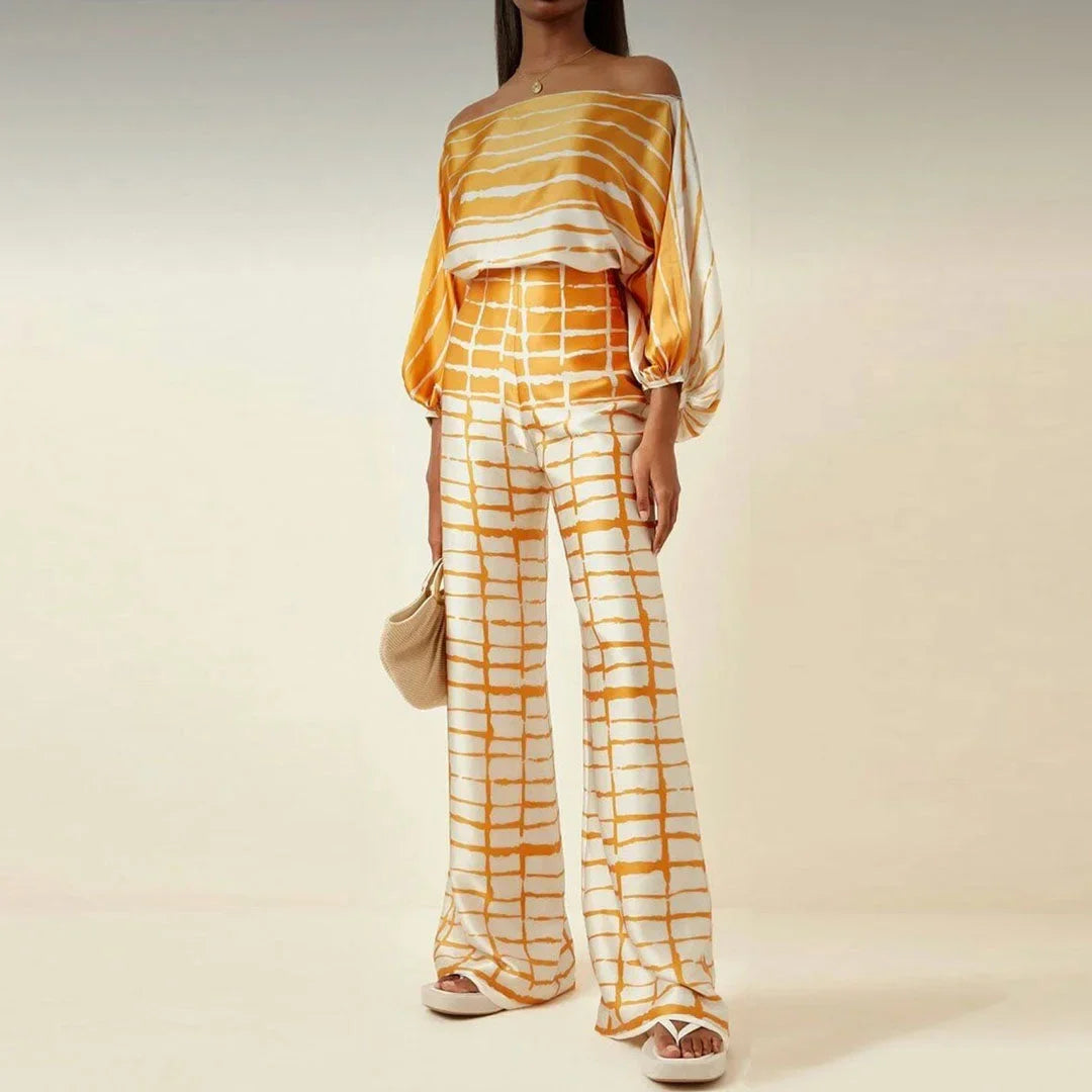 Ensemble femme en tissu léger, jaune, avec manches tombantes et pantalon droit, parfait pour une tenue décontractée.
