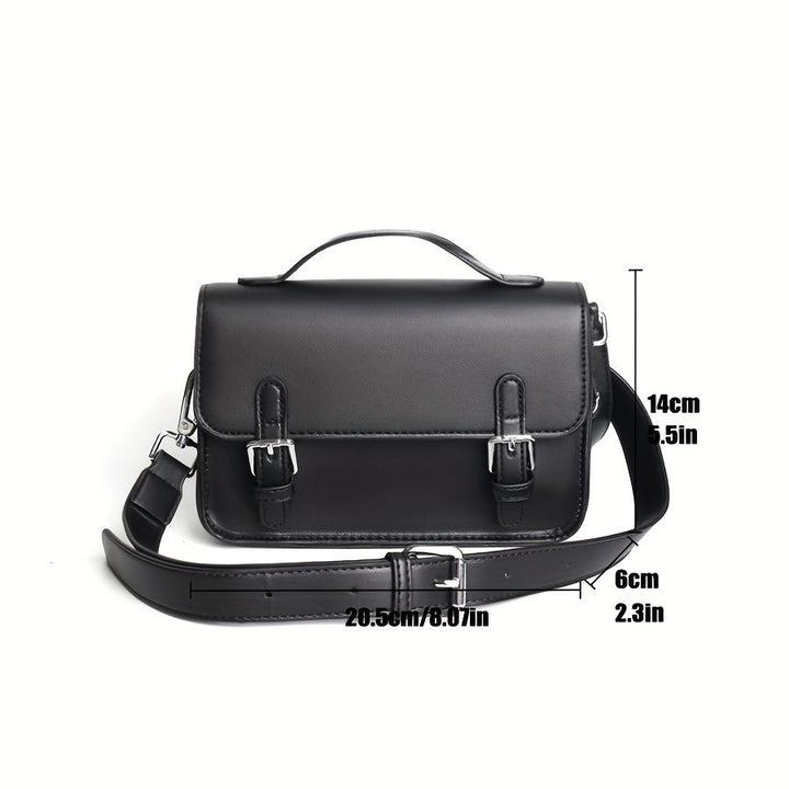 Borsa a tracolla in pelle nera con fibbie argentate, manico superiore e tracolla regolabile. Dimensioni: 20,5x14x6 cm. Elegante e versatile.