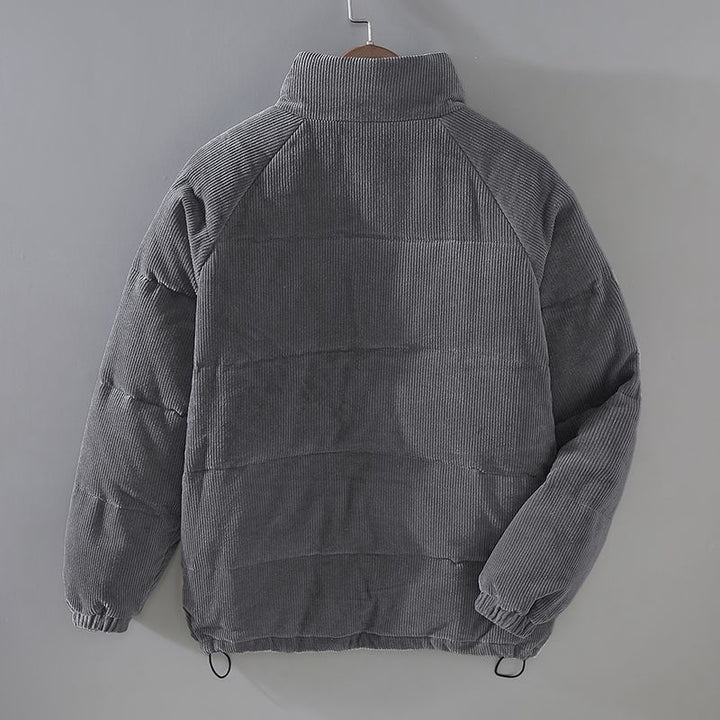Giacca invernale grigia in velluto a coste, design trapuntato, collo alto, maniche lunghe, ideale per moda uomo, abbigliamento caldo e casual.