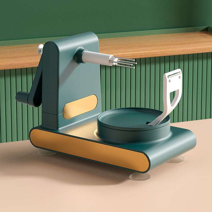 Macchina affetta verdure verde e oro su tavolo di legno, design moderno, cucina, utensile da cucina multifunzione, accessorio per taglio preciso.