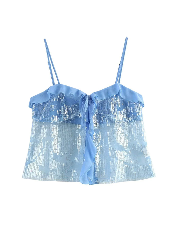 Haut femme bleu à sequins, avec détails en volants transparents pour un look élégant et festif.