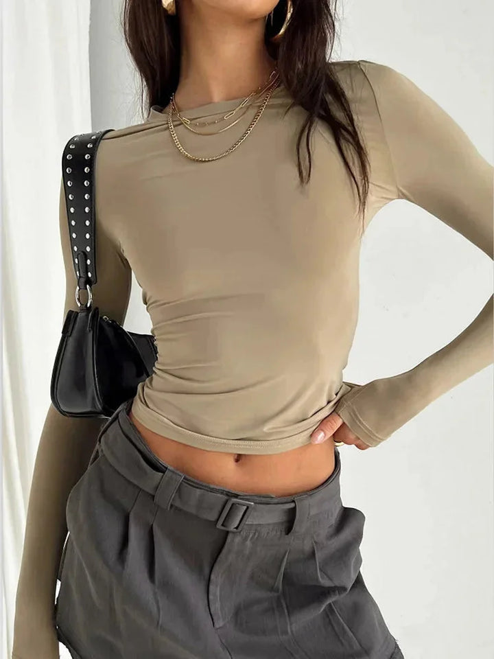 Haut slim femme gris à manches longues, en tissu extensible, coupe ajustée et facile d'entretien.