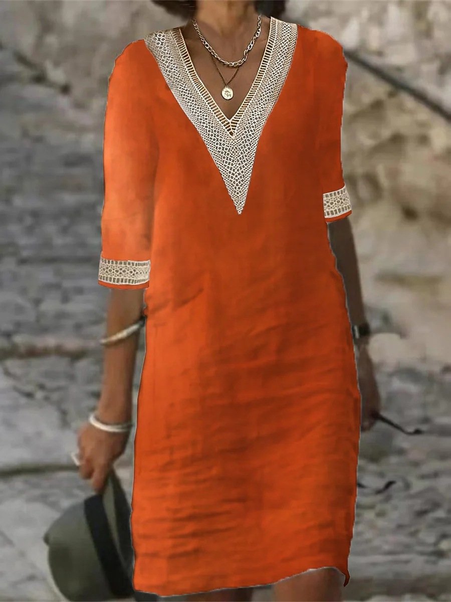 Abito estivo arancione in lino con scollo a V e dettagli in pizzo bianco, maniche a tre quarti. Perfetto per look casual e freschi.