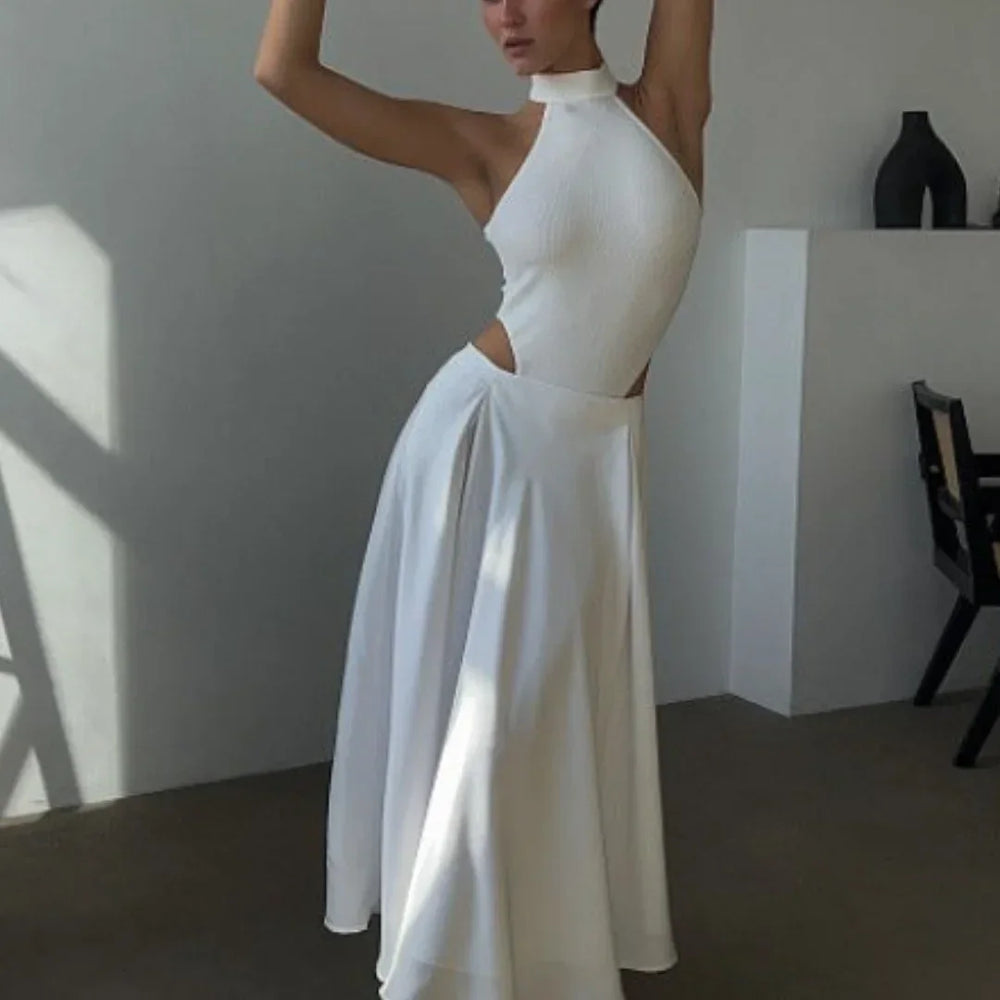 Jupe longue fluide blanche, taille haute, en tissu léger, idéale pour un look décontracté ou habillé, avec poches discrètes.