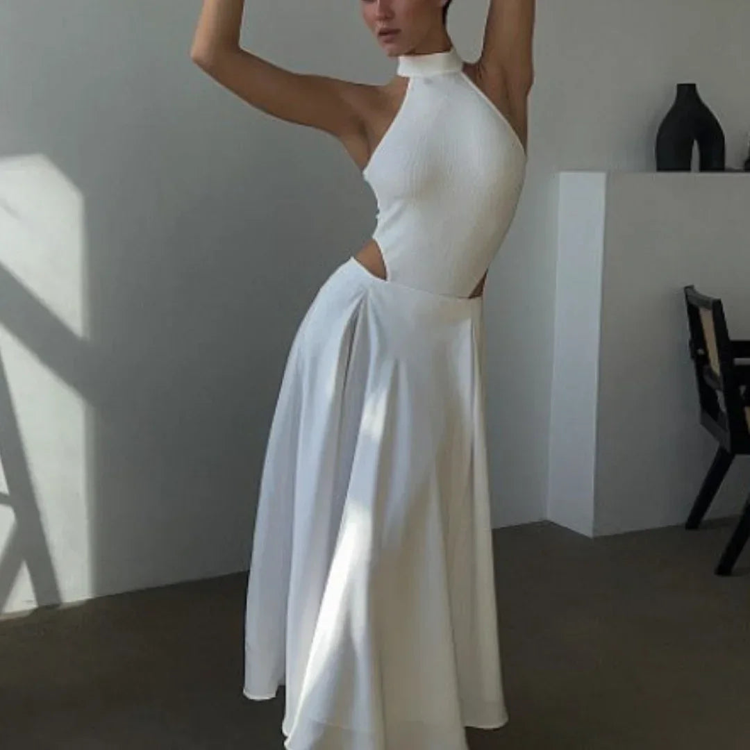Jupe longue fluide blanche, taille haute, en tissu léger, idéale pour un look décontracté ou habillé, avec poches discrètes.