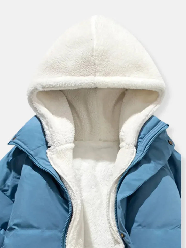 Doudoune d'hiver blanche pour femme avec capuche, doublure douce et fermeture éclair.