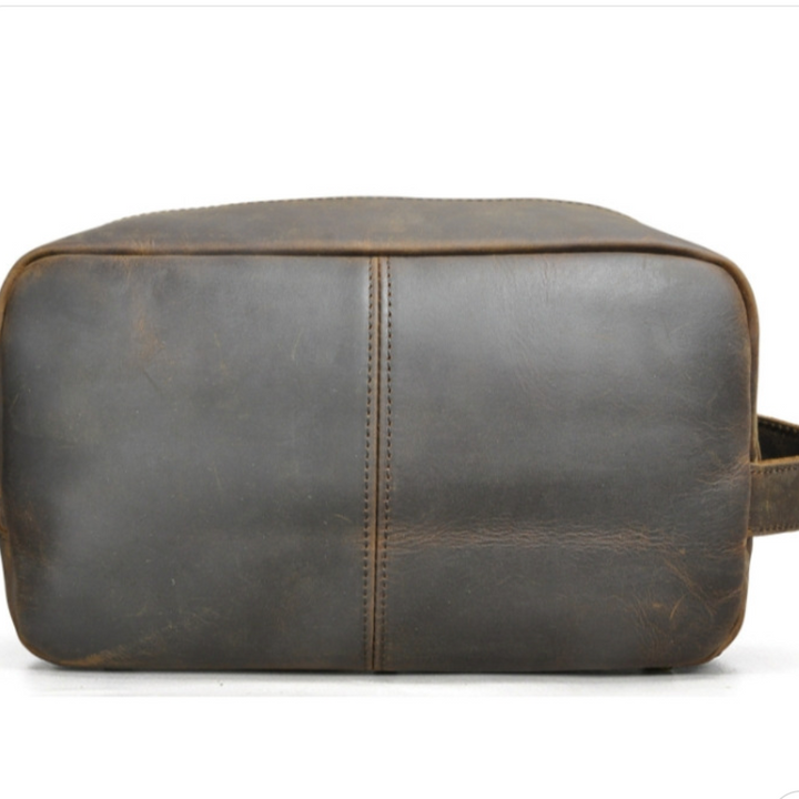 Borsa da viaggio in pelle marrone vintage, design rettangolare, cuciture centrali, ideale per uomo, accessorio elegante e resistente.
