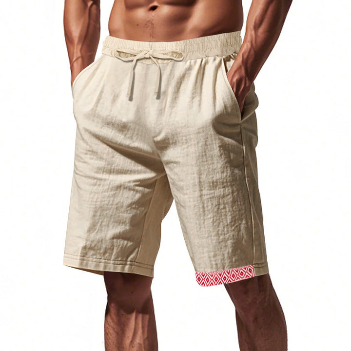 Pantaloncini uomo beige in lino, elastico in vita, tasche laterali, dettaglio rosso geometrico sull&
