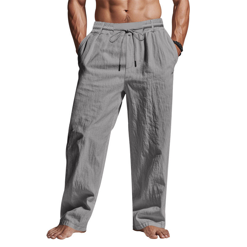 Pantaloni uomo grigi in lino, vita elastica con coulisse, tasche laterali, stile casual estivo, comodi e leggeri.