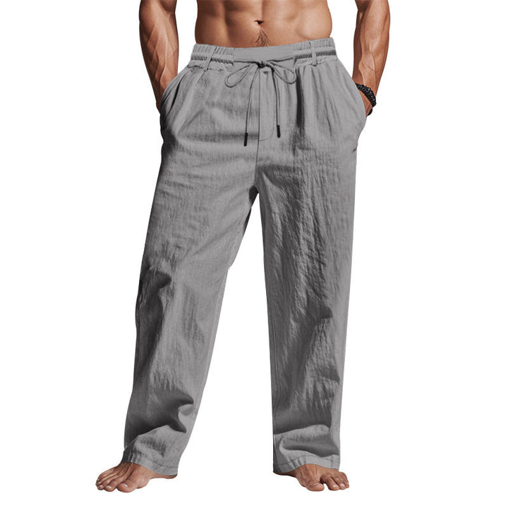 Pantaloni uomo grigi in lino, vita elastica con coulisse, tasche laterali, stile casual estivo, comodi e leggeri.