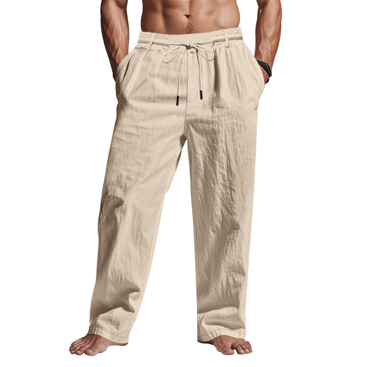 Pantaloni uomo beige in lino, elastico in vita, tasche laterali, stile casual estivo, comodi e traspiranti, perfetti per look rilassato.