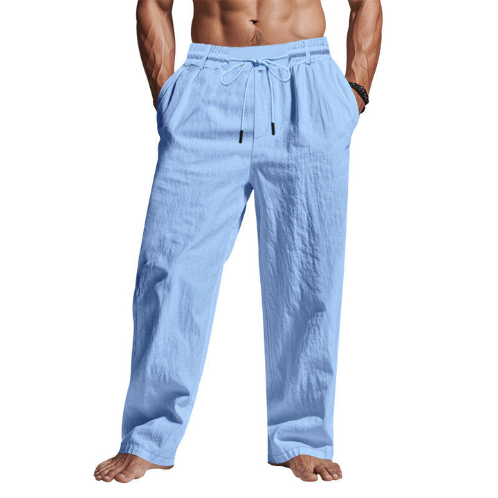 Pantaloni uomo in lino azzurro, elastico in vita con coulisse, tasche laterali, stile casual estivo. Ideali per moda maschile leggera e traspirante.