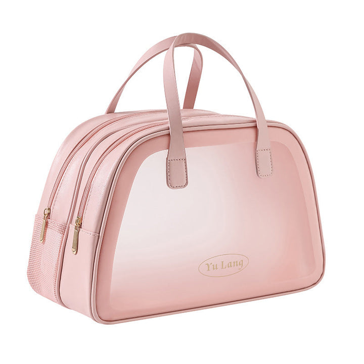 Borsa da viaggio rosa in pelle sintetica con doppia cerniera e manici, design elegante e spazioso, ideale per viaggi e uso quotidiano.