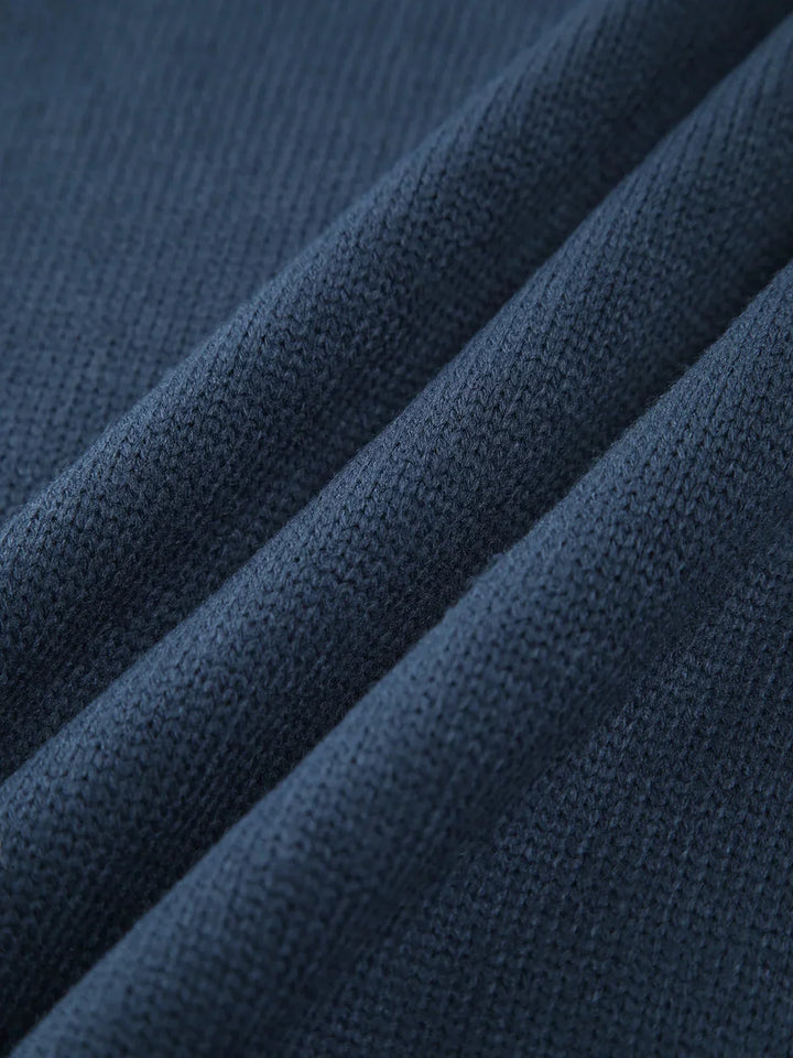 Pull col roulé côtelé pour femme, manches longues, en mélange de coton extensible pour un confort optimal.