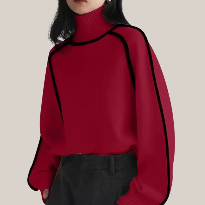Pull col roulé femme gris foncé avec bordure contrastée et tricot doux.