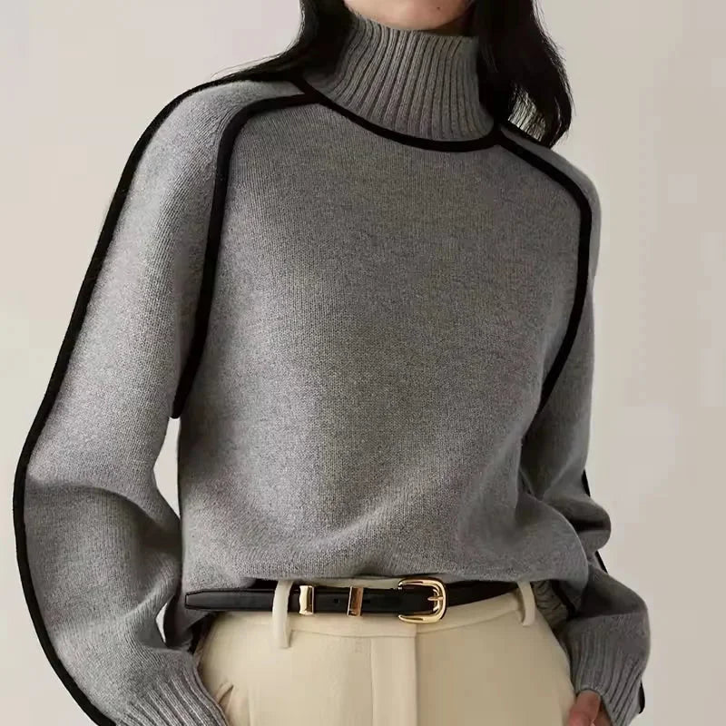 Pull col roulé femme beige avec bordure contrastée, en matière douce et élastique pour un confort optimal.