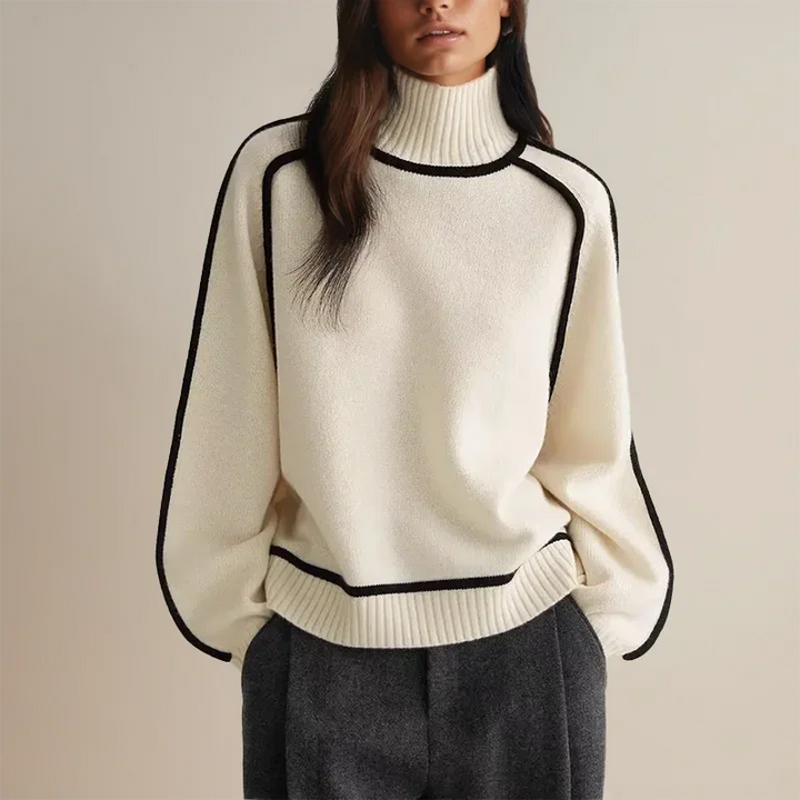 Pull col roulé femme en tricot doux, avec bordure contrastée aux manches et au bas. Couleur : brun.