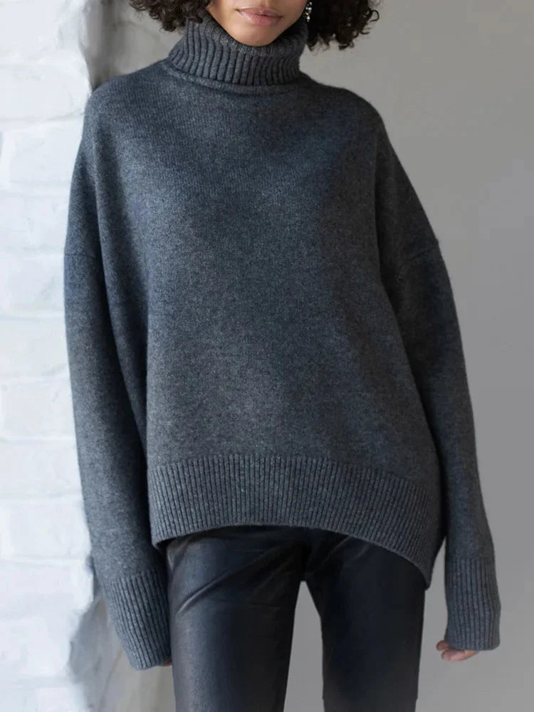 Pull col roulé blanc pour femme, en mélange de coton, manches longues et bords côtelés.