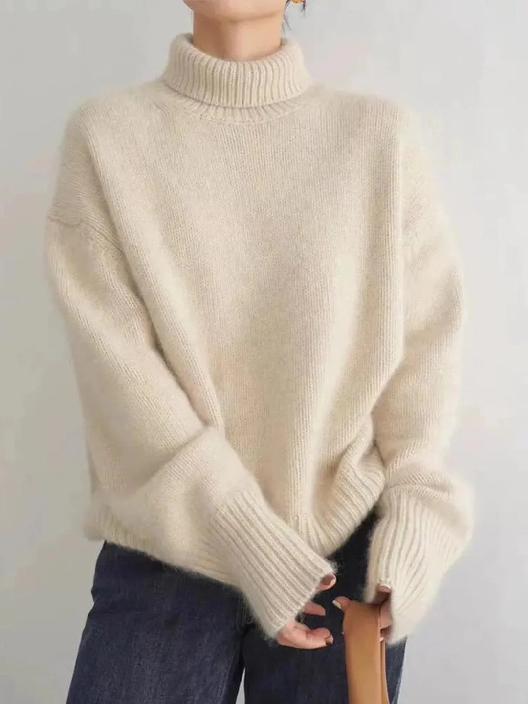 Pull à col roulé femme gris, en mélange de coton doux et respirant, adapté pour les journées fraîches.