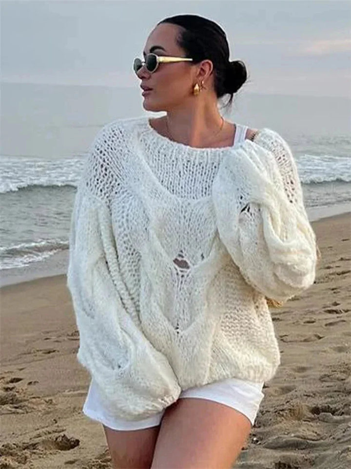 Pull ample pour femme en tricot, couleur jaune, avec une silhouette décontractée et un col rond.