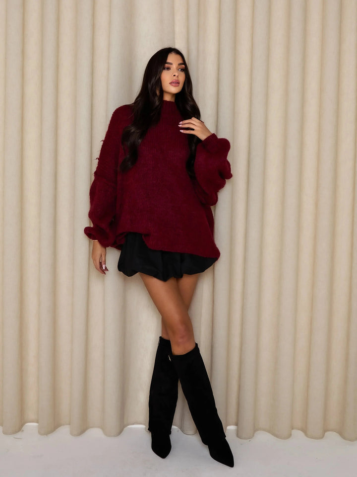 Pull ample pour femme en mélange de coton, col roulé, manches longues, design intemporel.