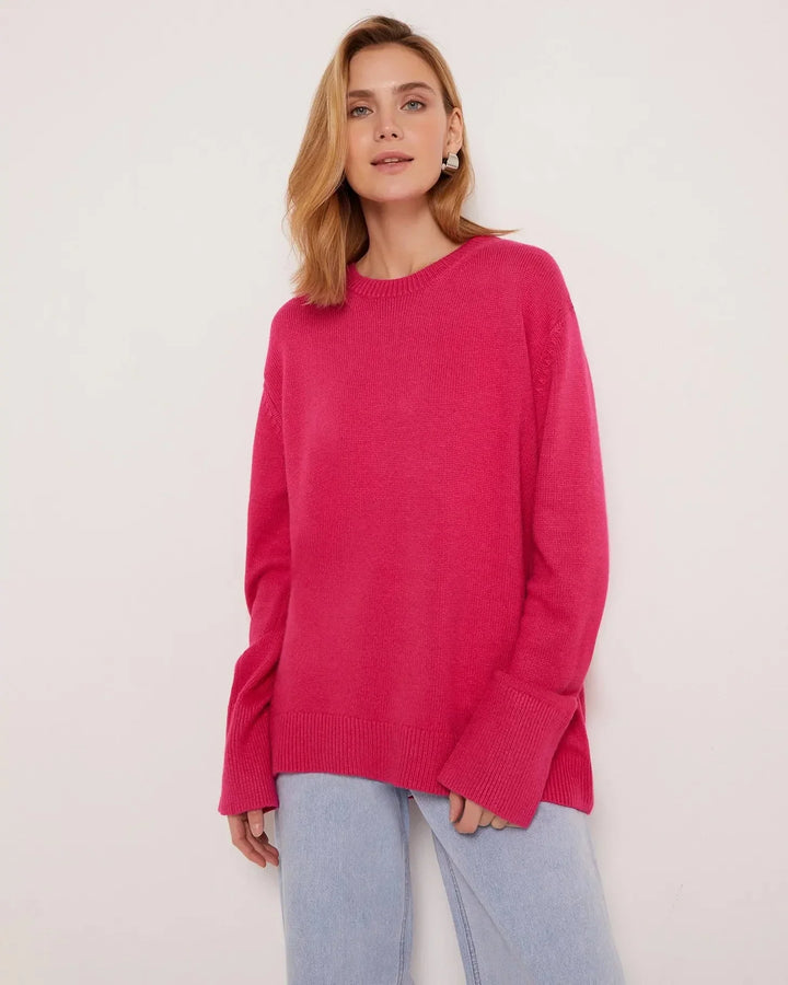Pull femme bleu clair, manches longues, col rond, en matière douce.