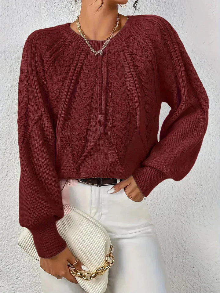 Pull femme kaki à motif torsadé, manches longues et tissu doux pour un confort optimal.