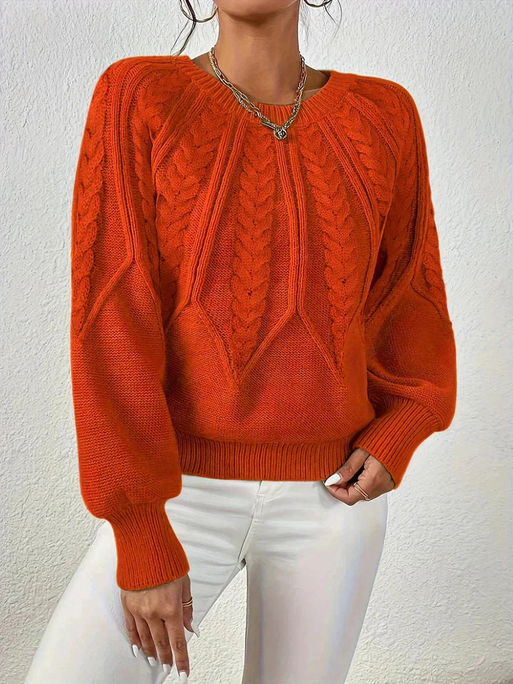 Pull femme kaki en laine épaisse, à manches longues et motif torsadé.