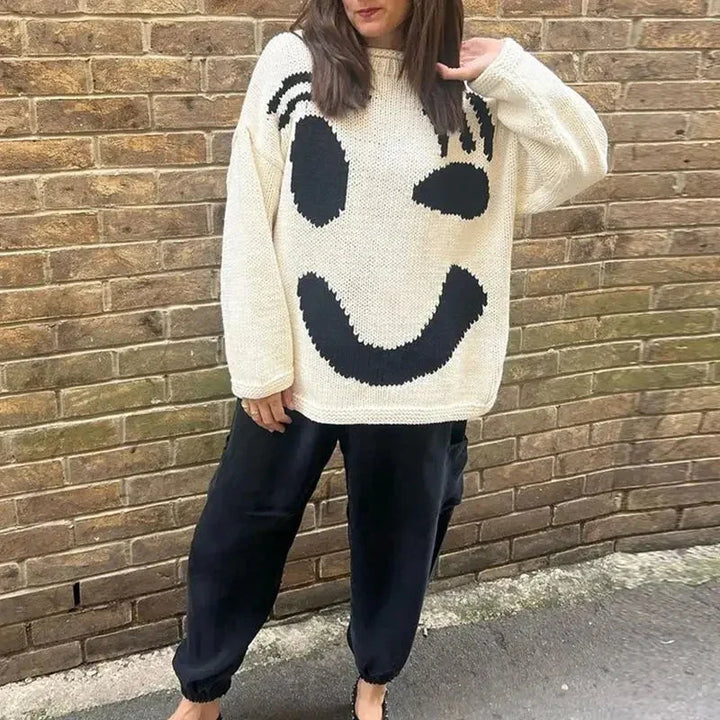 Pull femme oversize kaki avec motif smiley et manches longues, en mélange de coton.