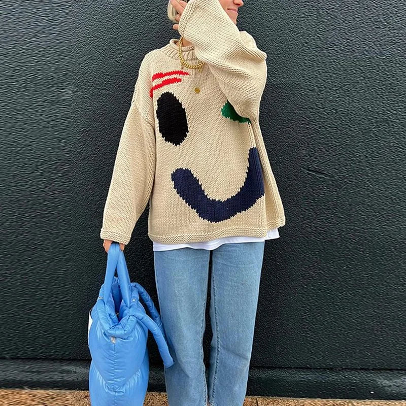 Pull femme oversize bleu à motif smiley, manches longues, en mélange de coton.