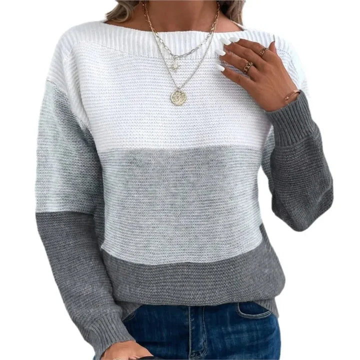Pull femme tricolore en maille patchwork avec texture et design moderne.