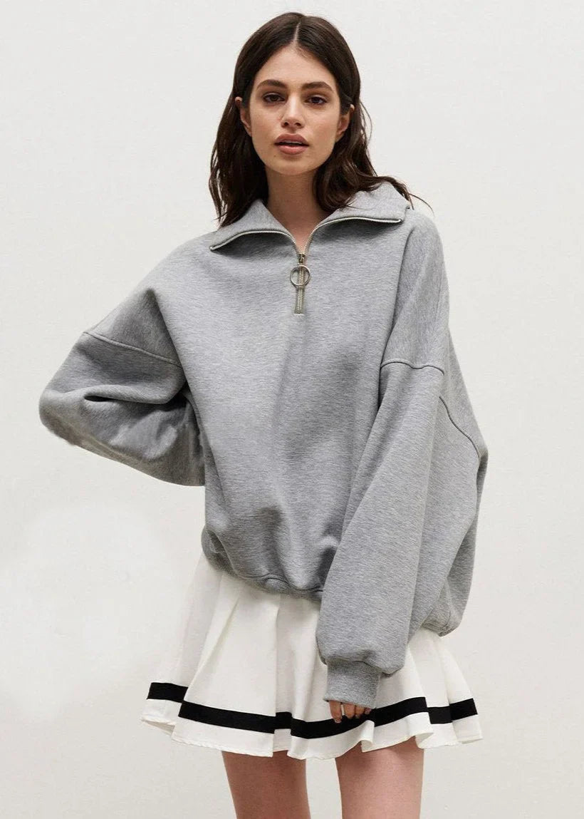 Pull à fermeture éclair bleu marine, coupe décontractée en mélange de coton, parfait pour des tenues décontractées.