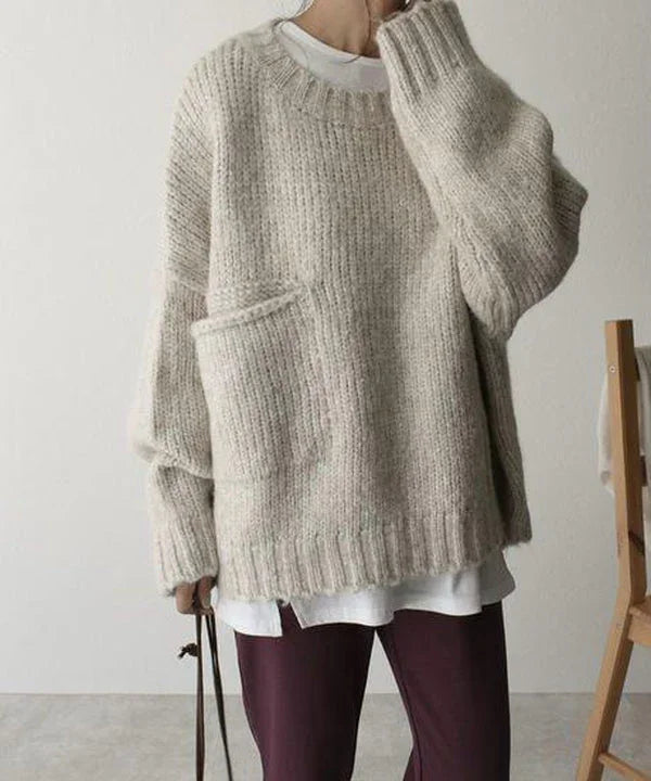 Pull over gris oversize femme en mélange de coton, avec poche avant pratique.