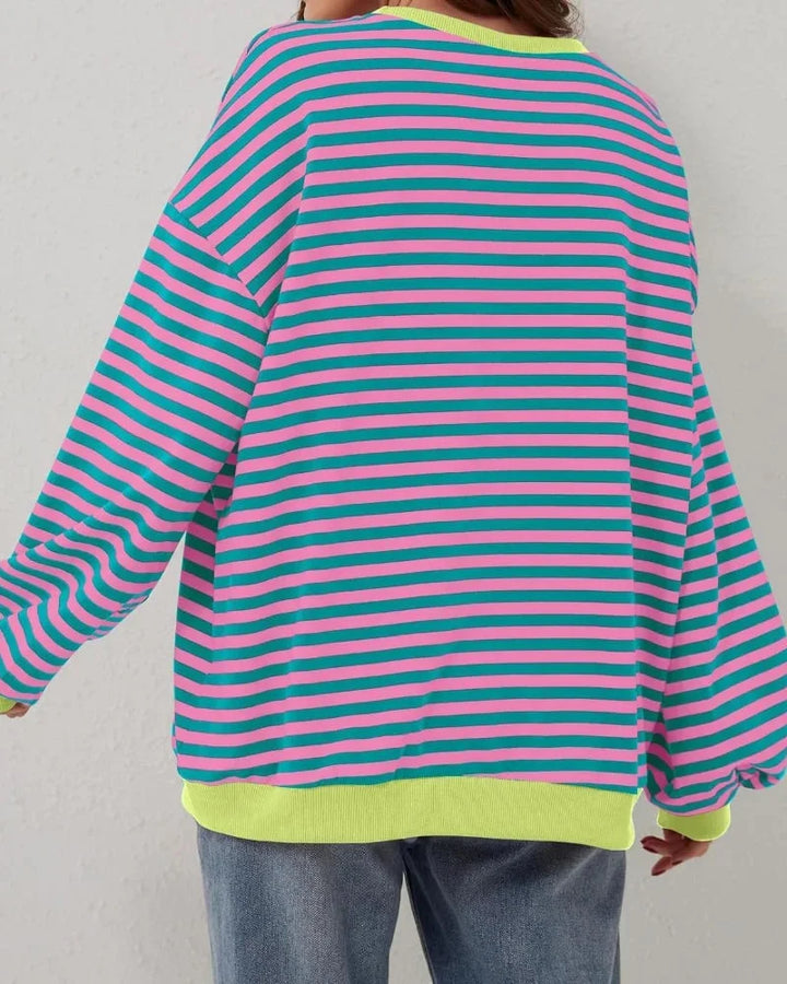 Pull oversize rayé pour femme en rose, en coton doux, idéal pour un look décontracté.