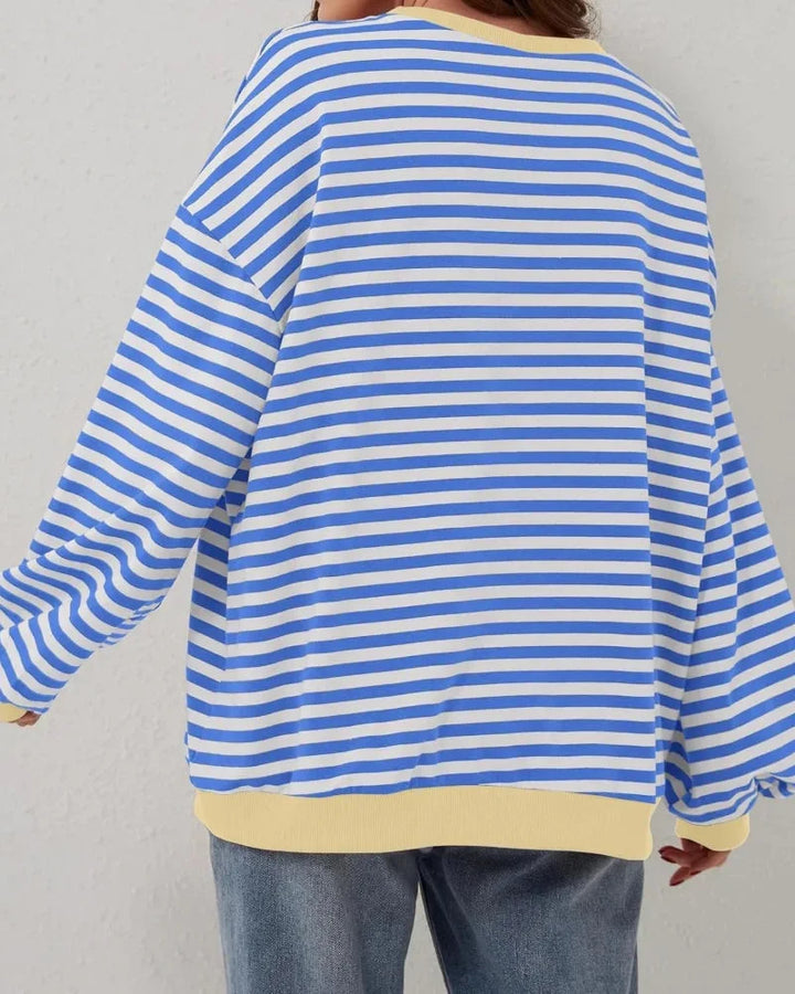 Pull rayé oversize bleu pour femme, en mélange de coton, conçu pour un style décontracté et un confort optimal.