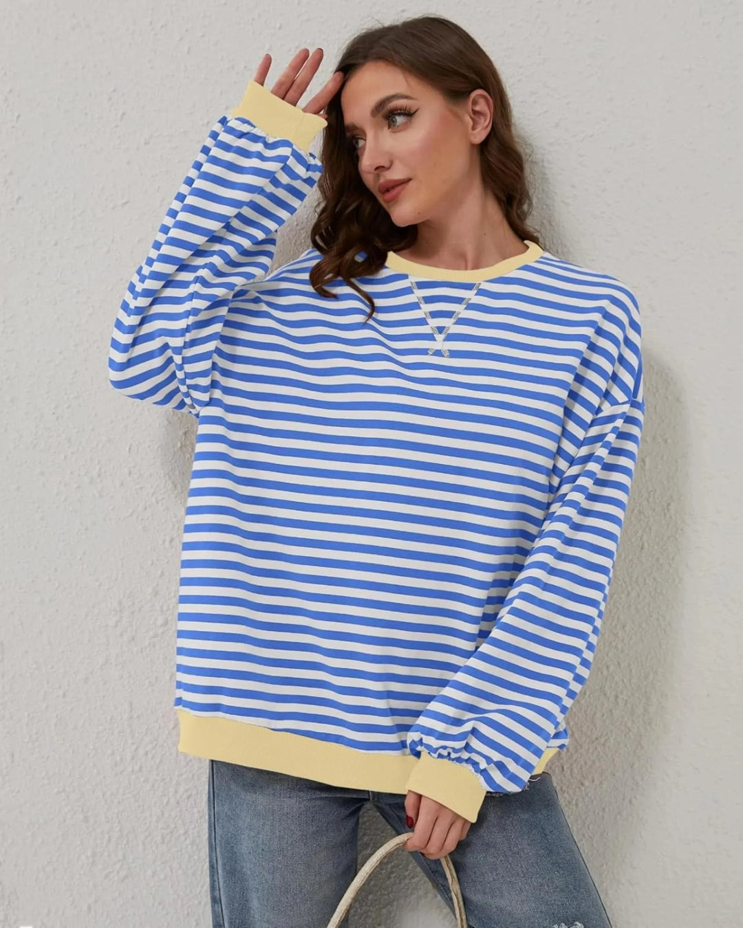 Pull rayé oversize rose pour femme, en coton doux, parfait pour un style décontracté.