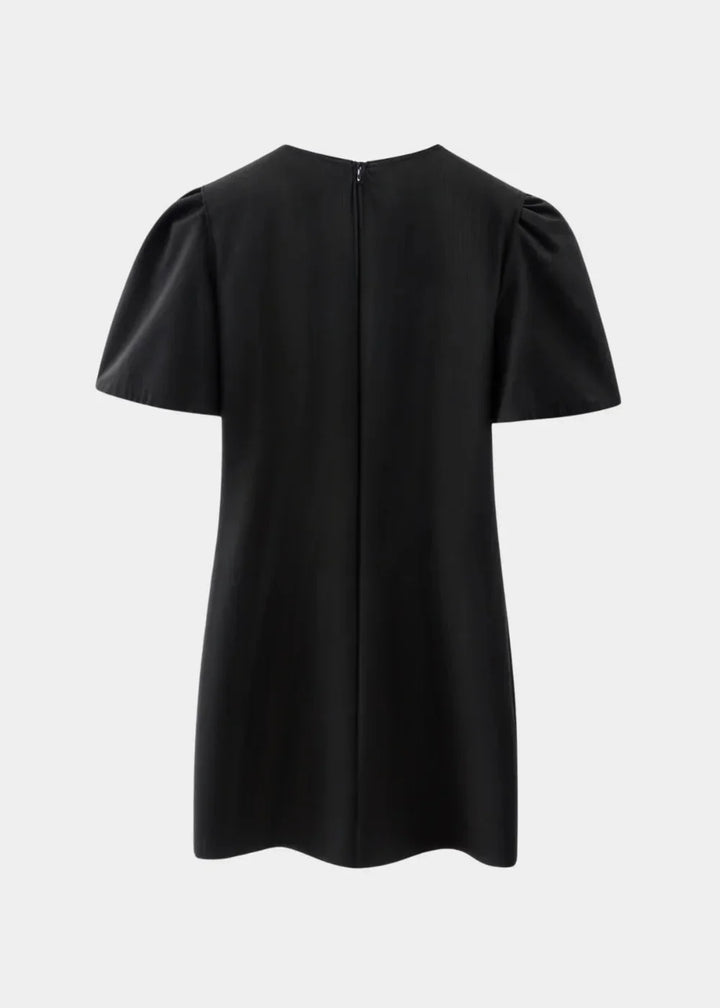 Robe courte à pois avec nœuds, manches bouffantes, en tissu léger, idéale pour une soirée d'été.
