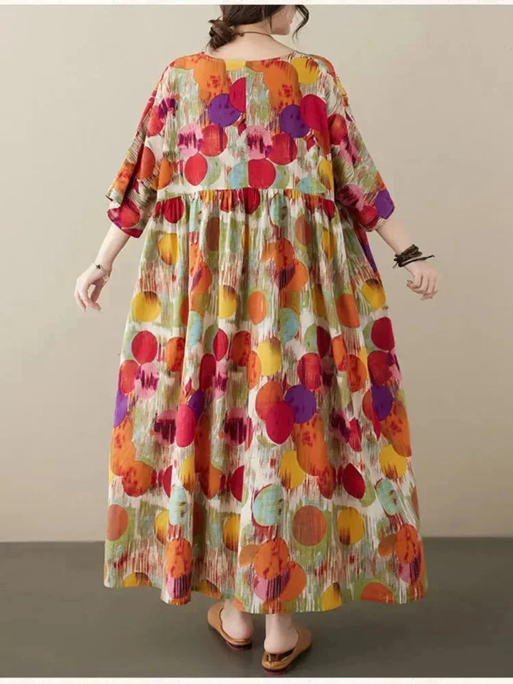Robe longue pour femme, ample, en tissu léger avec un imprimé artistique et des manches mi-longues. Parfaite pour les…
