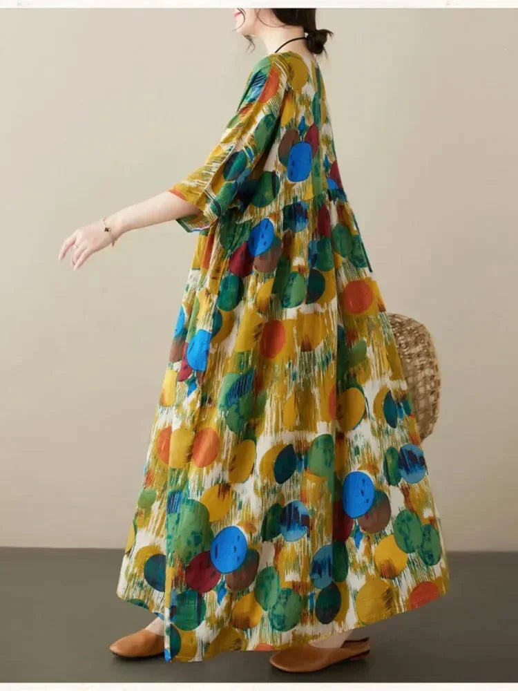 Robe longue ample pour femme, en tissu léger avec imprimé artistique et manches mi-longues, parfaite pour un look…