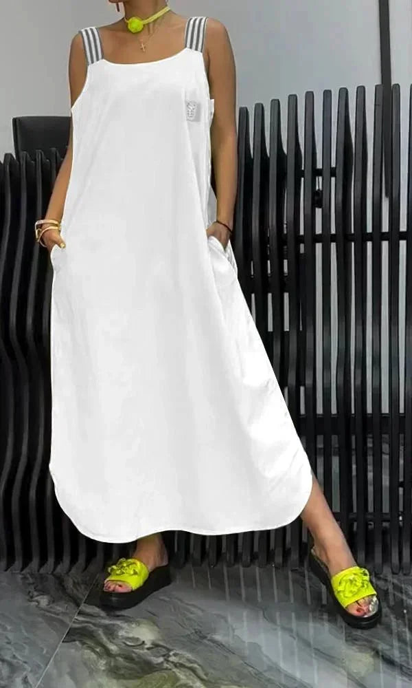 Robe longue femme en coton léger, bretelles larges, poches latérales, idéale pour un confort quotidien.