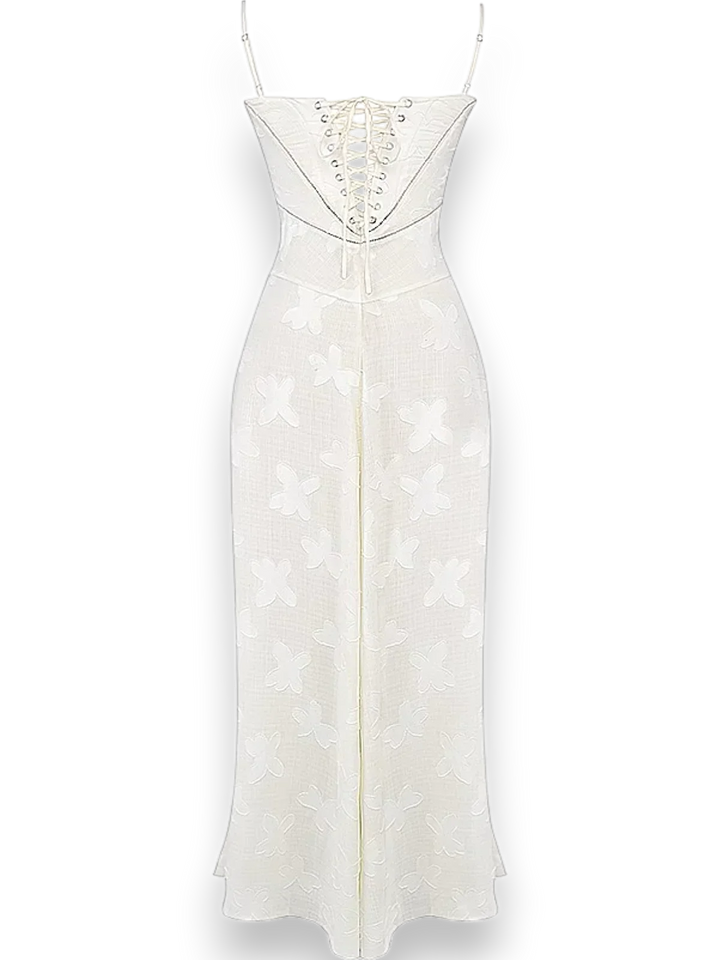 Robe longue en coton avec broderie florale délicate et bretelles fines, parfaite pour les journées ensoleillées.