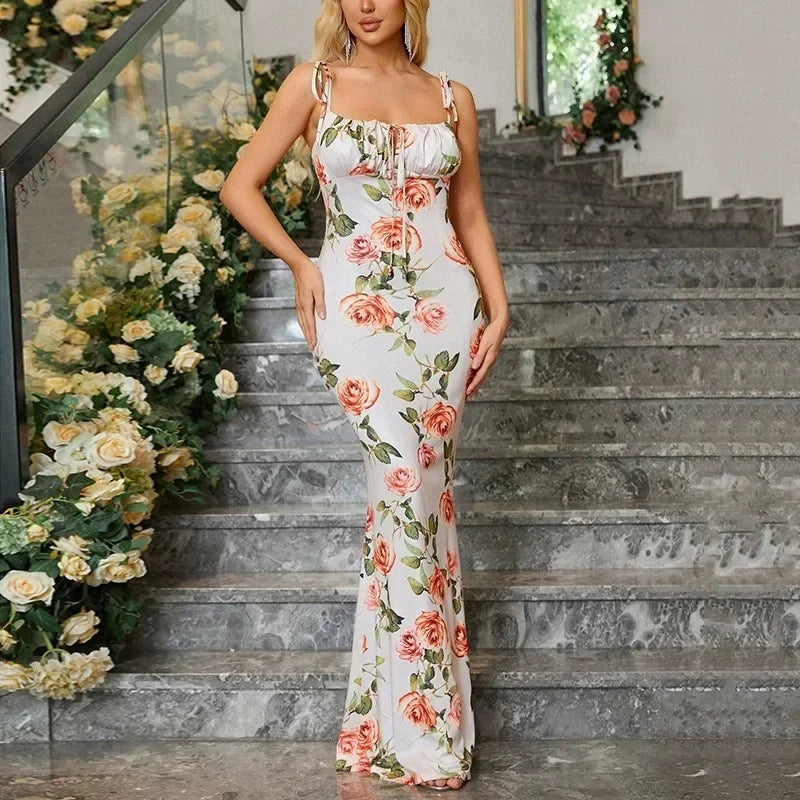 Robe longue femme en coton avec motifs floraux, bretelles nouées, et coupe fluide pour un confort optimal.