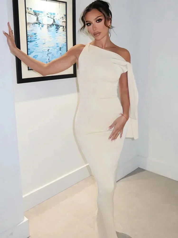 Robe longue femme sans manches en coton, avec nœud décoratif à la taille et design fluide pour un confort optimal.