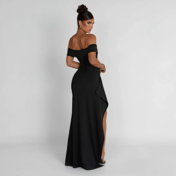 Robe longue femme en tissu léger, épaules dénudées, élégante fente sur le côté pour un look moderne et aéré.