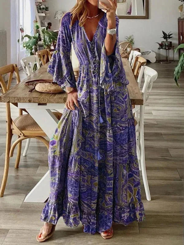 Robe longue bohème violet pour femme, manches évasées, imprimée estivale en tissu léger et fluide. Parfaite pour les…