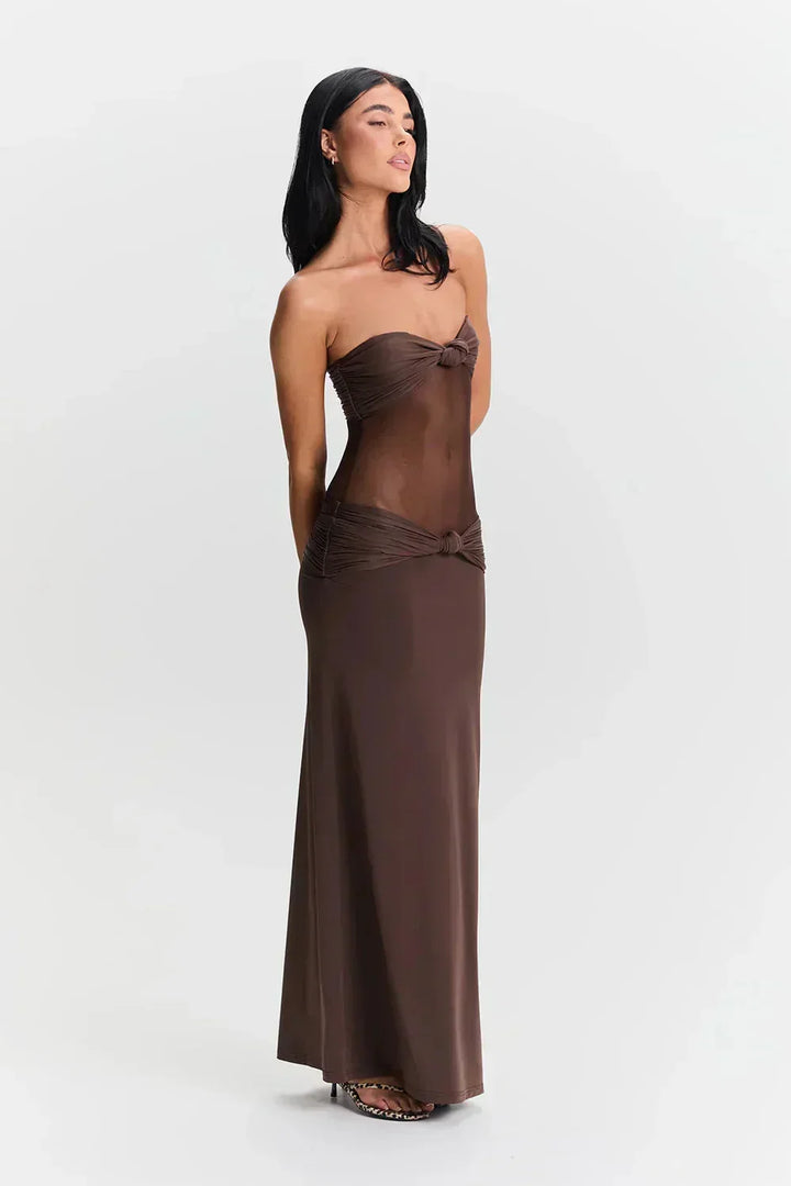 Robe longue femme en tissu léger, bustier avec détail transparent et nœud élégant à la taille, parfaite pour les soirées.